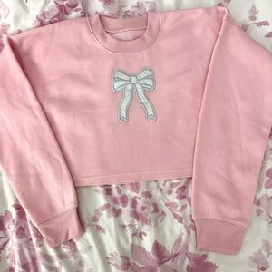 Cropped Preppy coquette pink sweatshirt with silver glitter bow appliqué